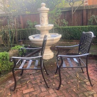 Pair of metal patio chairs with table