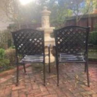 Pair of metal patio chairs with table