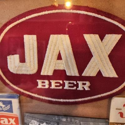 Lot #31  Framed JAX Beer Memorabilia - Notepads, Photo Postcard, Coasters, Uniform Patch