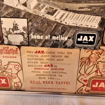 Lot #31  Framed JAX Beer Memorabilia - Notepads, Photo Postcard, Coasters, Uniform Patch