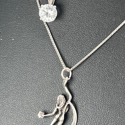 Two sterling pendants and chains