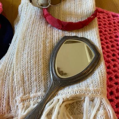 Sterling hand mirror, chrochet shawls, hats, and headbands and sterling handheld mirror