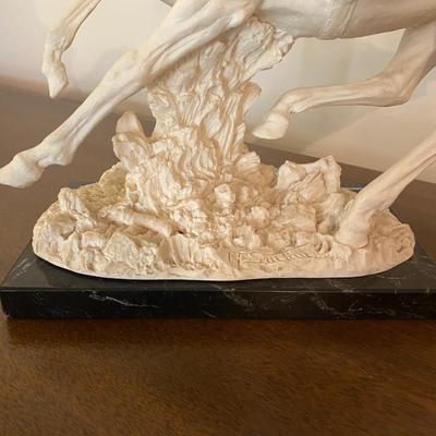 A. Santini western sculpture, the virgin mary wall hanging and more