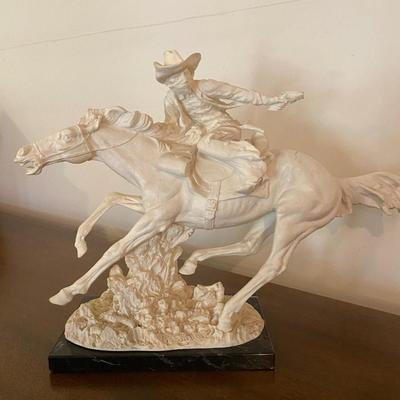 A. Santini western sculpture, the virgin mary wall hanging and more