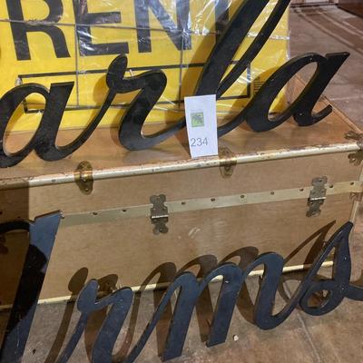 Building signs and vintage trunk