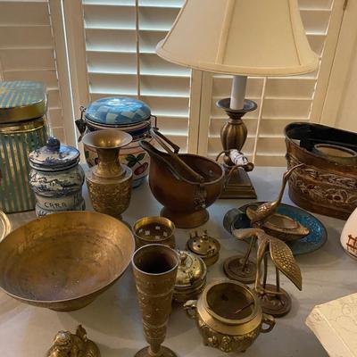 Collection of incense burners, brass bowls, table lamp, tins and more.