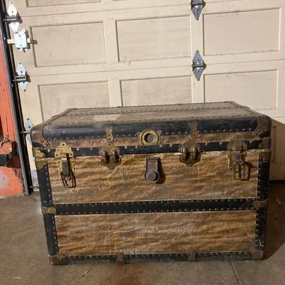 Steamer trunk with faux holiday flowers
