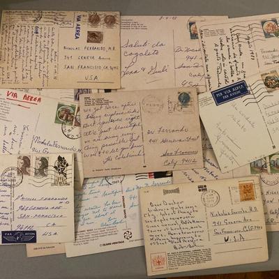 Large collection of old Travel postcards with stamps and  coins