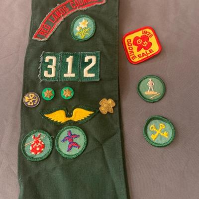 Vintage Girl Scout sash with badges and pins