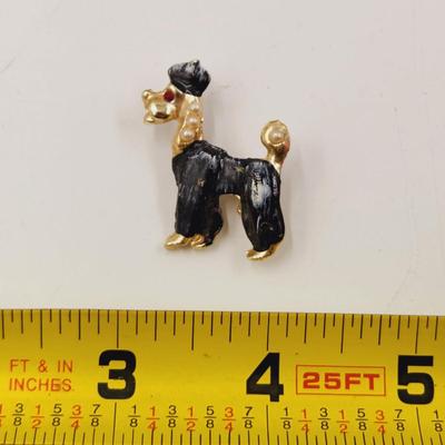 VINTAGE GOLD TONED POODLE PIN W/ RED JEWELED EYE