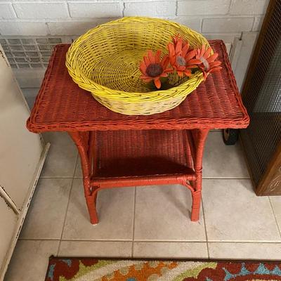 Vintage Wicker Table with detailed V shaped shelf 2'W 2.5'H reddish orange, round yellow basket