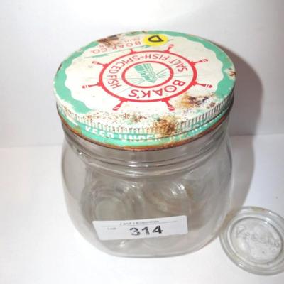 VINTAGE GLASS JAR CONTAINING GLASS CANNING LIDS