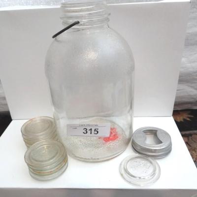 VINTAGE GLASS JUG AND GLASS CANNING LIDS