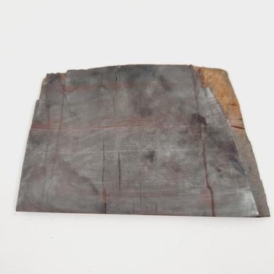 A SORT OF SLICED METAL BASED ROCK