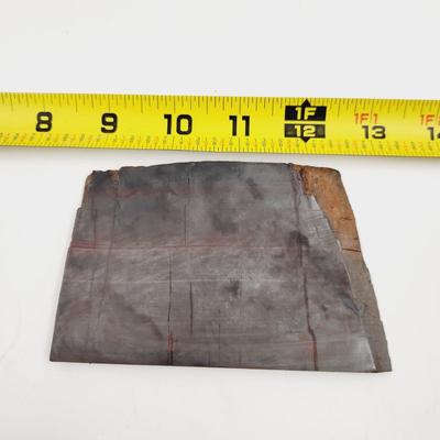 A SORT OF SLICED METAL BASED ROCK
