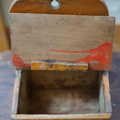 PRIMITIVE GROUPING A HAND CRAFTED STOOL AND HAND MADE SALT BOX OF ORANGE PAINT