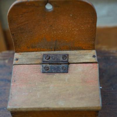 PRIMITIVE GROUPING A HAND CRAFTED STOOL AND HAND MADE SALT BOX OF ORANGE PAINT