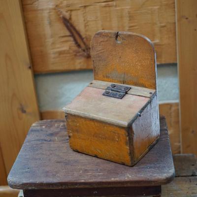 PRIMITIVE GROUPING A HAND CRAFTED STOOL AND HAND MADE SALT BOX OF ORANGE PAINT