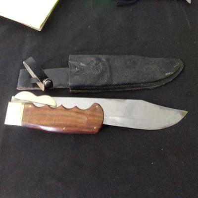 17" FOLDING SHEATH KNIFE. 12" FOLDED. 1" THICK HANDLE.