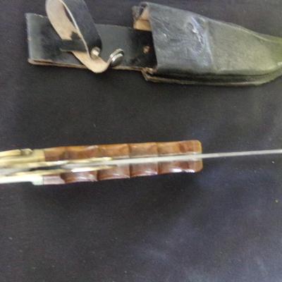 17" FOLDING SHEATH KNIFE. 12" FOLDED. 1" THICK HANDLE.