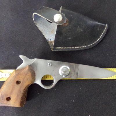 8" PISTOL GRIP FOLDING KNIFE. 5" WHEN FOLDED.