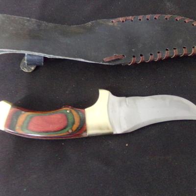 10" SHEATH KNIFE WITH 1" THICK HANDLE.