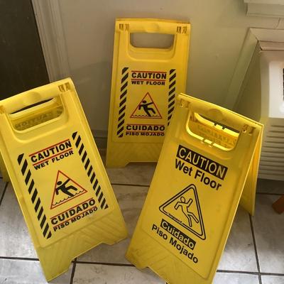 144 Three Caution Wet Floor Signs