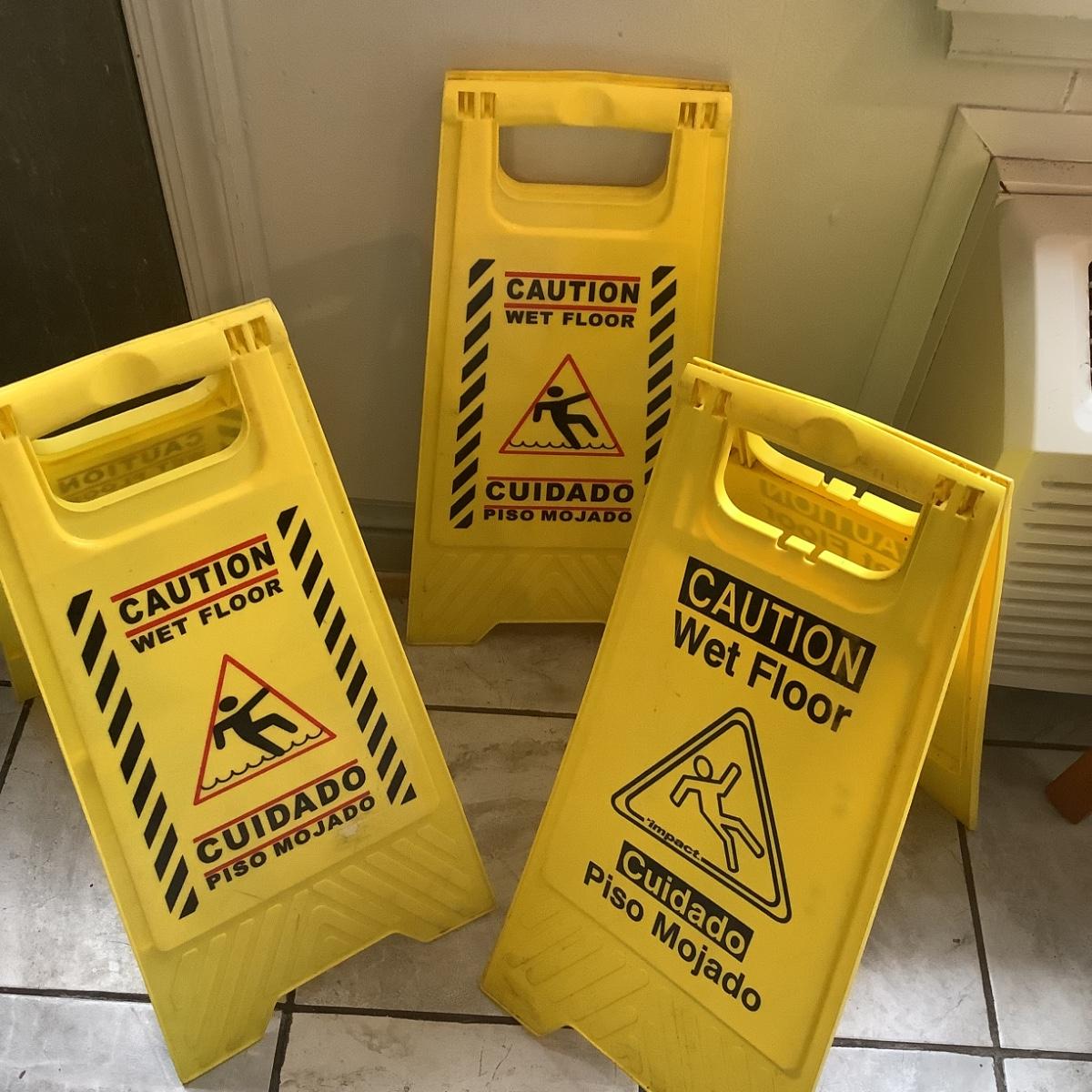144 Three Caution Wet Floor Signs