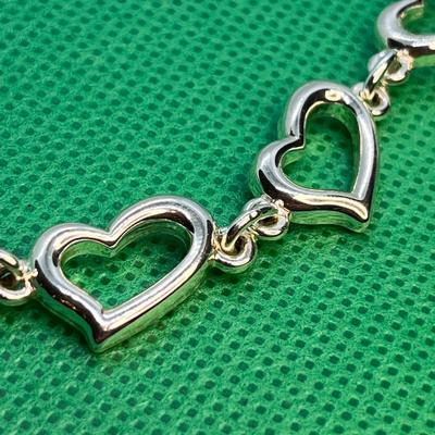 SHINY SILVER TONE HEARTS BRACELET