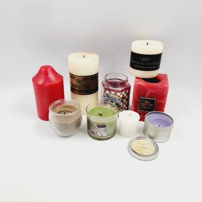 9 SLIGHTLY USED MULTI COLORED CANDLE BUNDLE