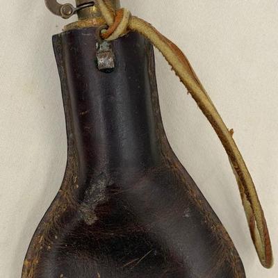 Antique leather birdshot pellet pouch with pellets inside