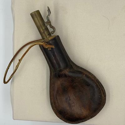 Antique leather birdshot pellet pouch with pellets inside