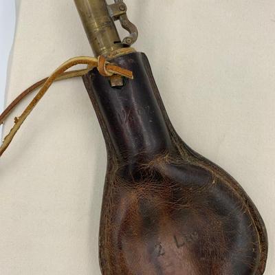 Antique leather birdshot pellet pouch with pellets inside