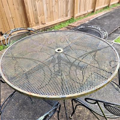 Lot #149  Vintage Cast Iron Patio set - table/4 chairs
