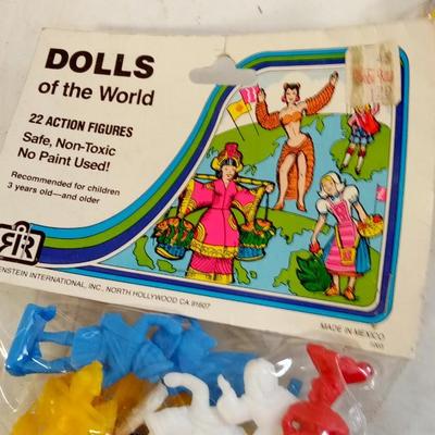 LOT 126   TWO BAGS OF PLASTIC DOLLS OF THE WORLD