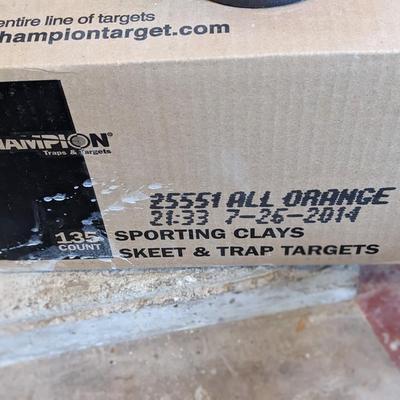 Clay Pigeon Thrower and New Box of Clay Pigeons