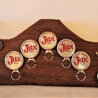 Lot #161  Lot of Vintage JAX beer bottle caps, etc mounted on board