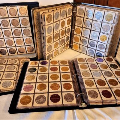 Lot #176  ATTIC FIND - 4 binders of vintage Mardi Gras Doubloons - 1 binder has bronzes