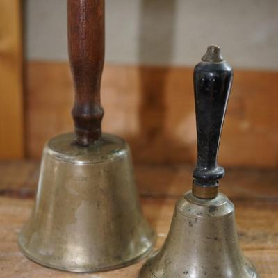 PAIR OF EARLY SCHOOL BELLS WITH TURNED HANDLES.