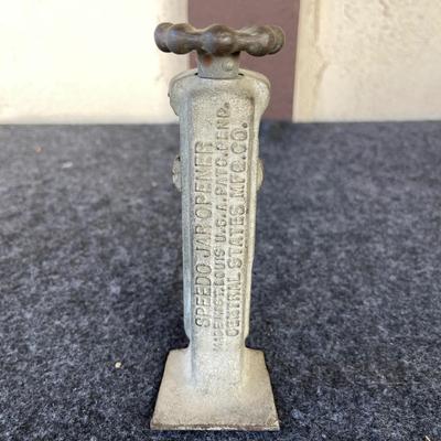 LOT 212 Antique Speedo Cast Iron Jar Opener 6" tall.