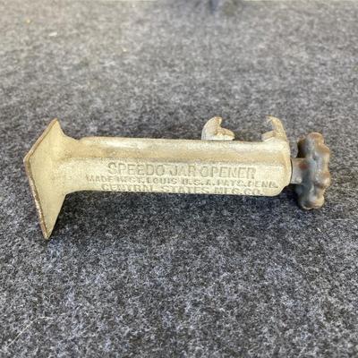 LOT 212 Antique Speedo Cast Iron Jar Opener 6" tall.