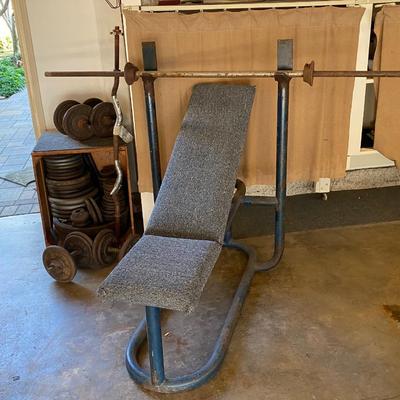 Vintage Adjustable Weight Bench with Multiple Bars Dumbbells