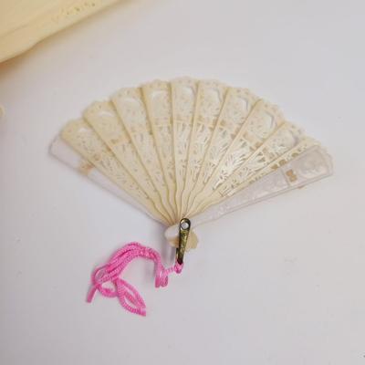 VINTAGE IVORY COLORED PLASTIC? FOLDING FAN