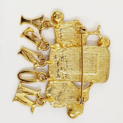GOLD TONED MONEY BROOCH