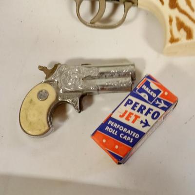 LOT 145    THREE OLD CAP GUNS