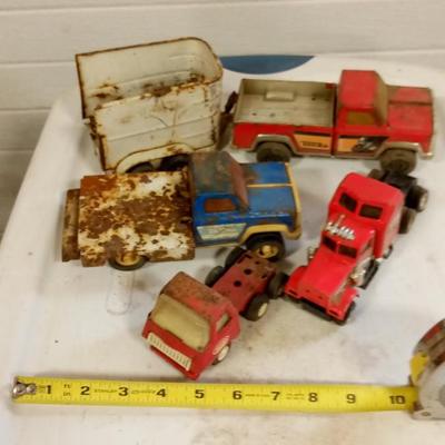 LOT 150   FOUR OLD TOY TRUCKS AND ONE TRAILER