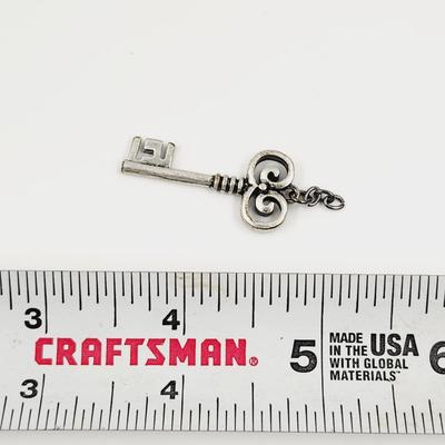 SILVER TONED KEY CHARM / PENDANT