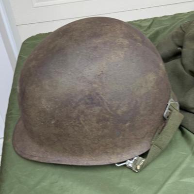 LOT:58G: Assortment of United State Military Helmets and liners, peak hat covers  and canvas field wash basins from different branches of...