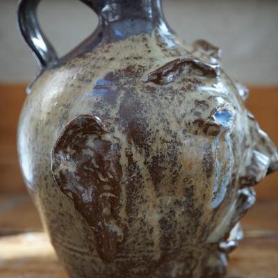 HAND CRAFTED FOLK ART "UGLY " FACE HANDLED JUG SIGNED SKINNER DATED 2005