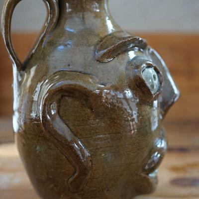 HAND CRAFTER FOLK ART POTTERY "UGLY" FACE HANDLED JUG SIGNED RPT. SMALLER SIZE JUG